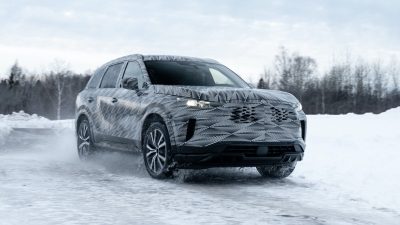 2022 INFINITI QX60 Premium SUV front side view driving in snow.