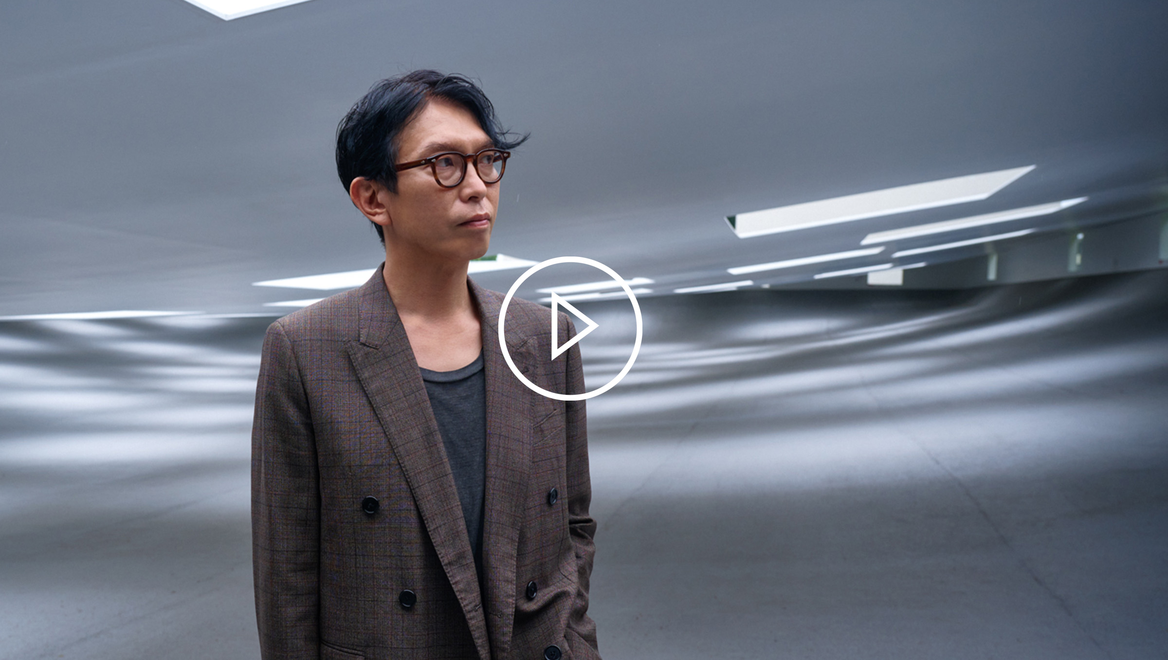 Japanese architect, Junya Ishigami wearing a brown blazer.