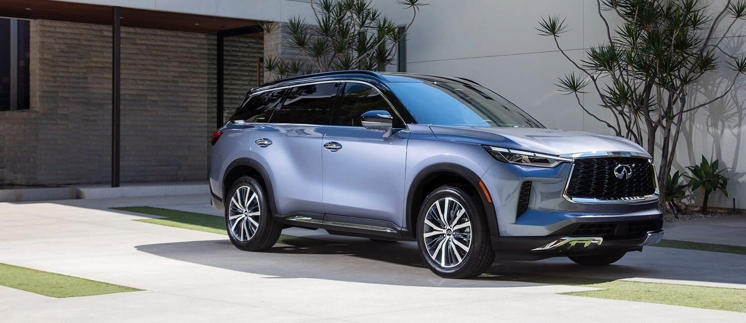 2022 INFINITI QX60 Silver Crossover SUV parked in front of house