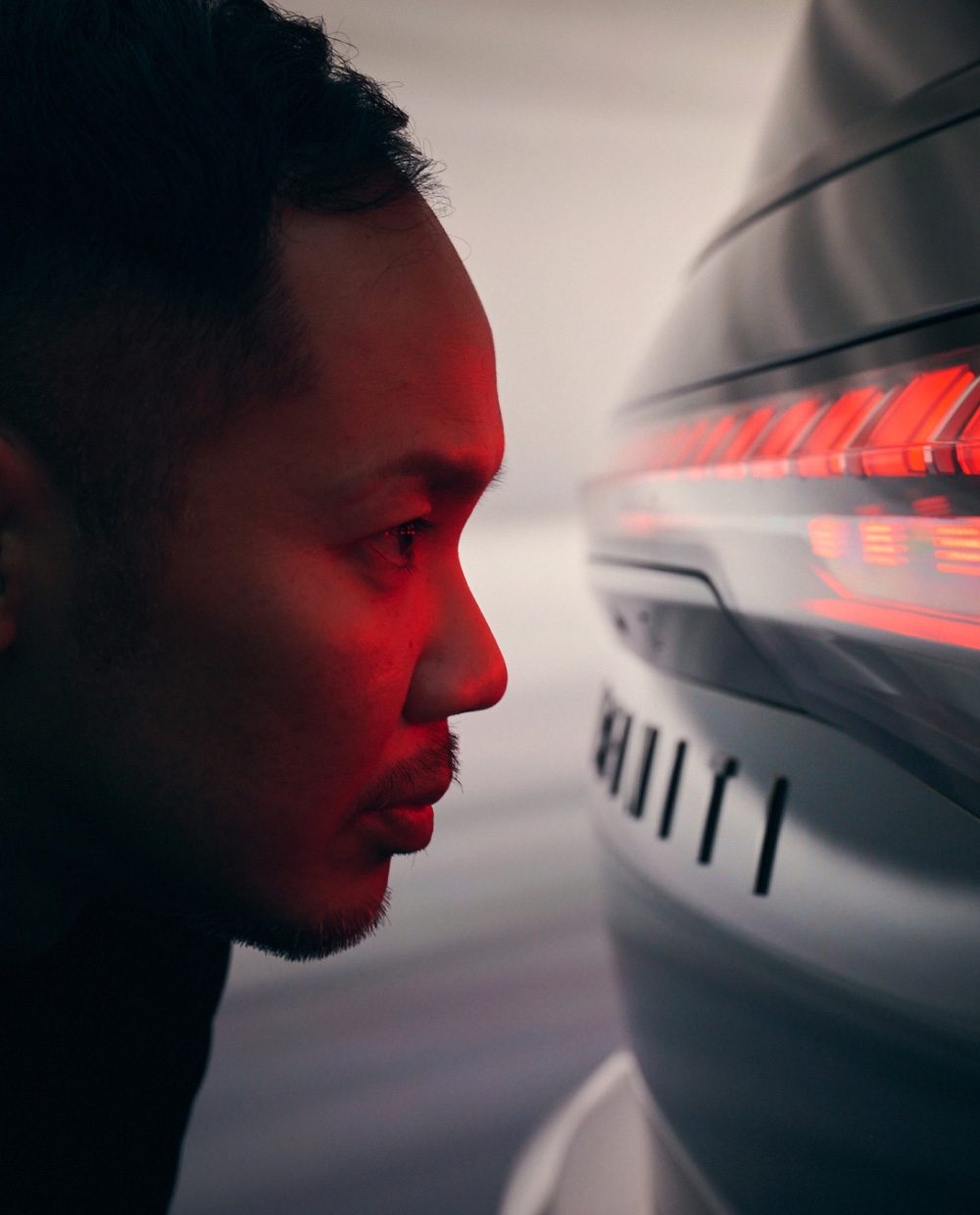 INFINITI Makers of QX80 Naomichi Ide examining LED tail lights
