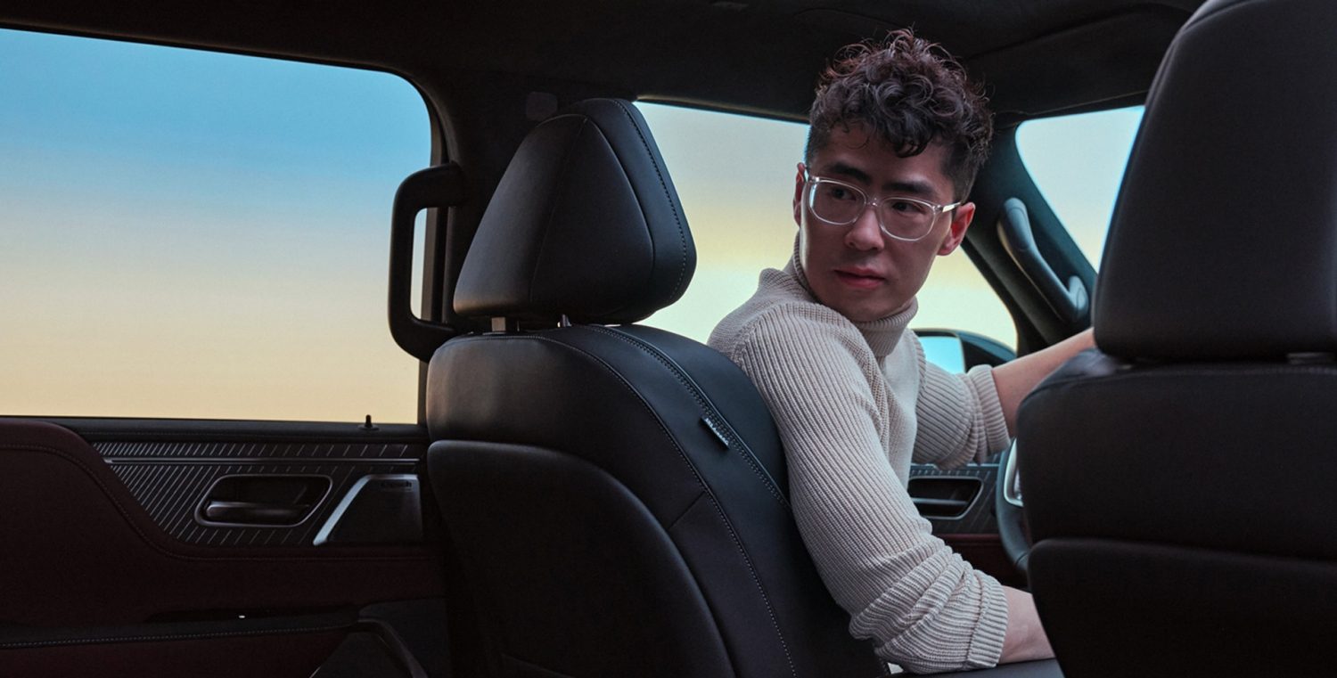 Tom Hu in the driver’s seat of the 2025 INFINITI QX80 SUV