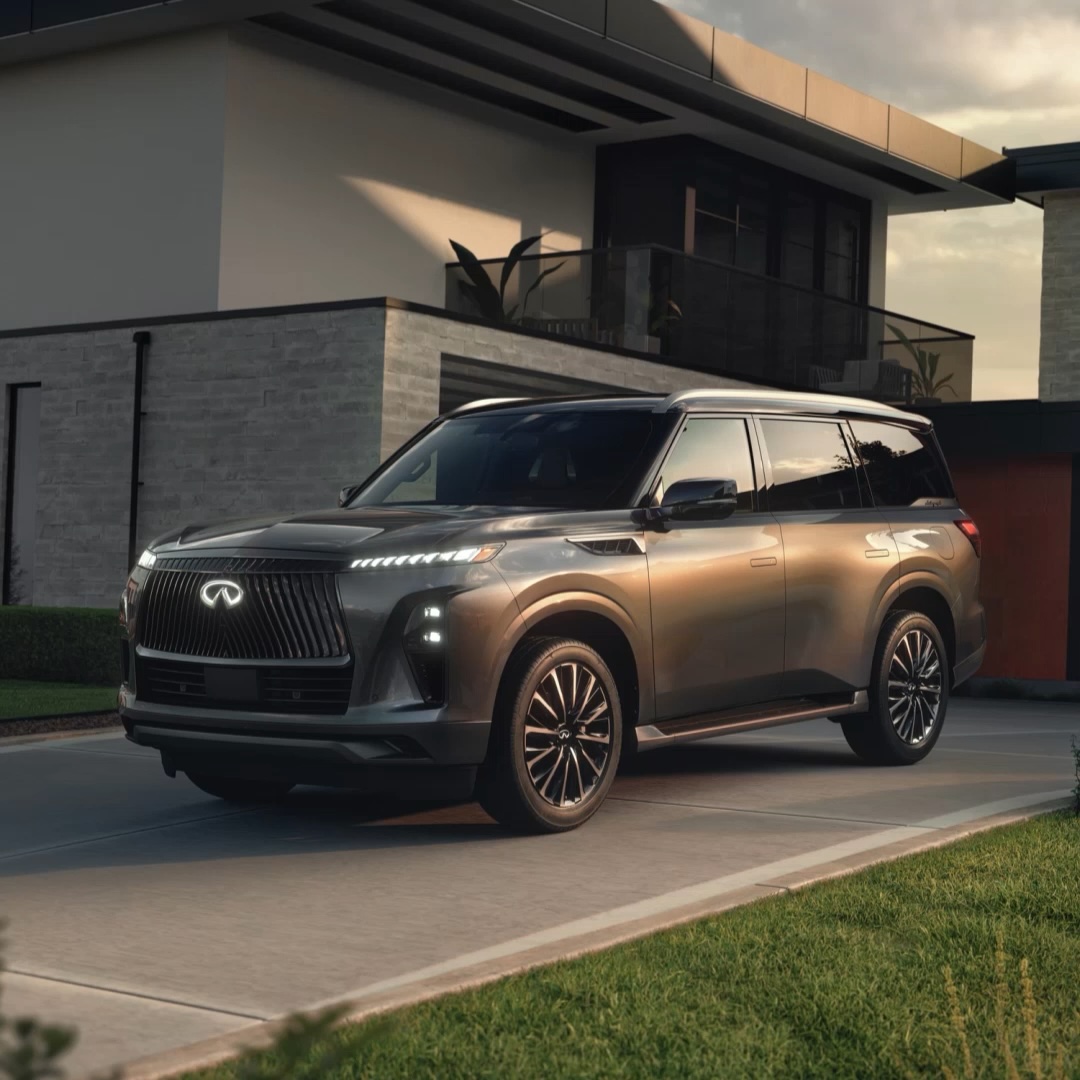 Dark grey 2025 INFINITI QX80 luxury SUV on a driveway