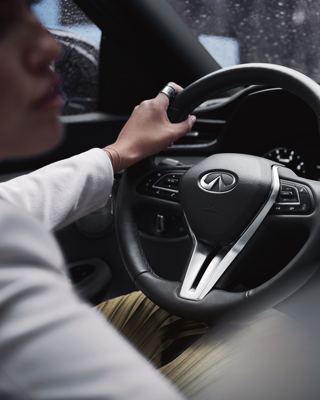 2025 INFINITI QX50 noise-cancelling interior audio system with serene driving environment in rain