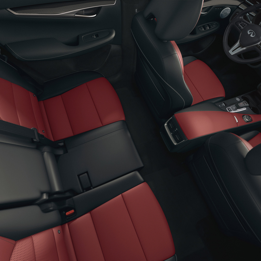 2025 INFINITI QX50 rear seating with red leather upholstery and extra legroom via sliding seats