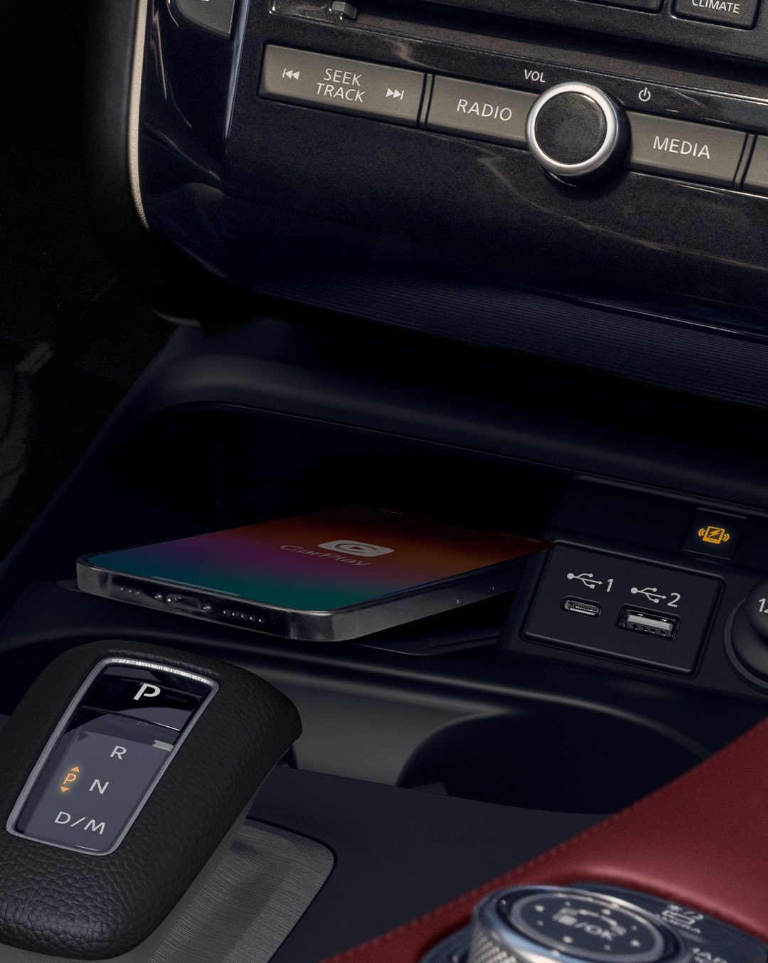 2025 INFINITI QX50 wireless charging zone and USB ports in center console with phone charging