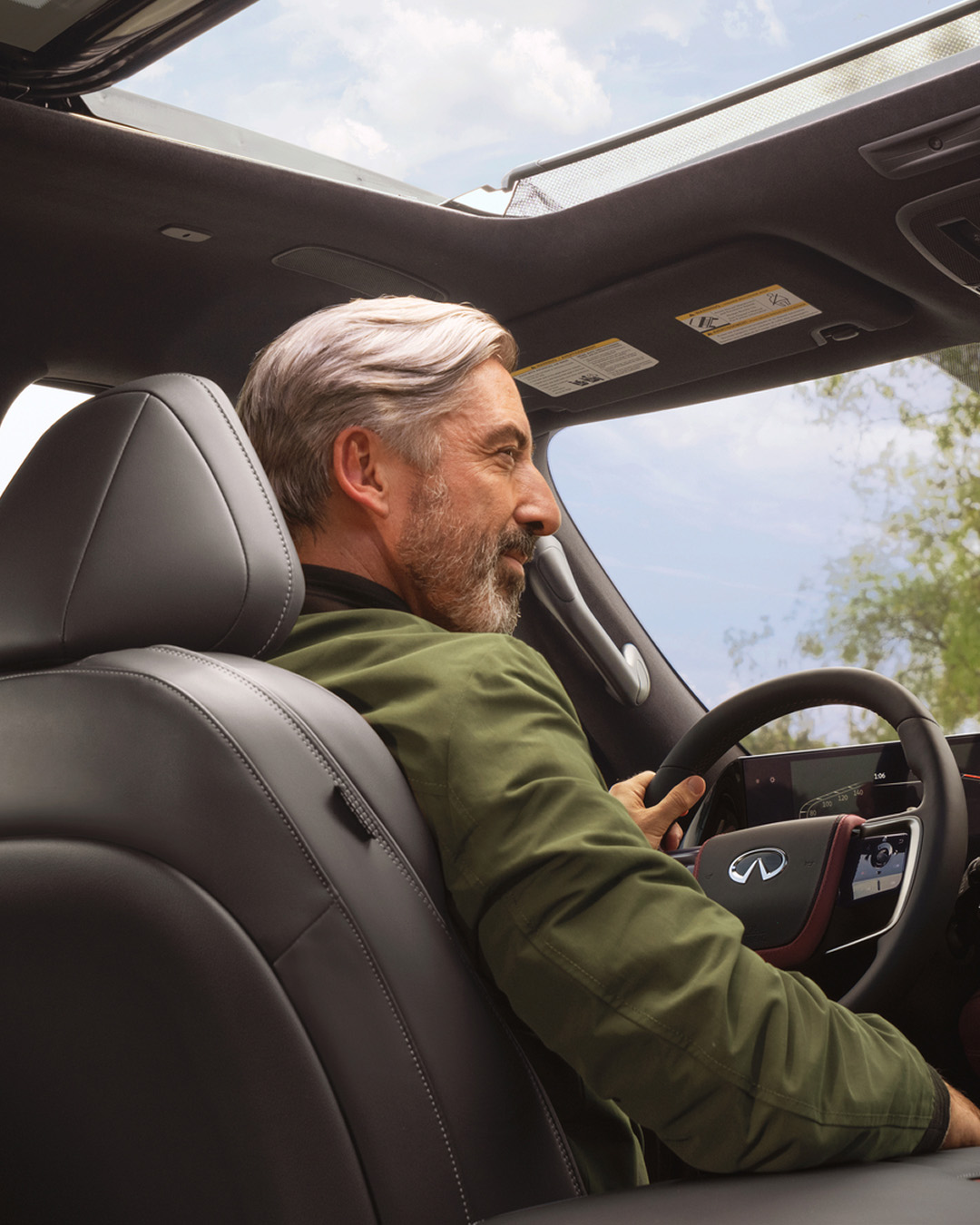 Interior view of INFINITI driver with moonroof open