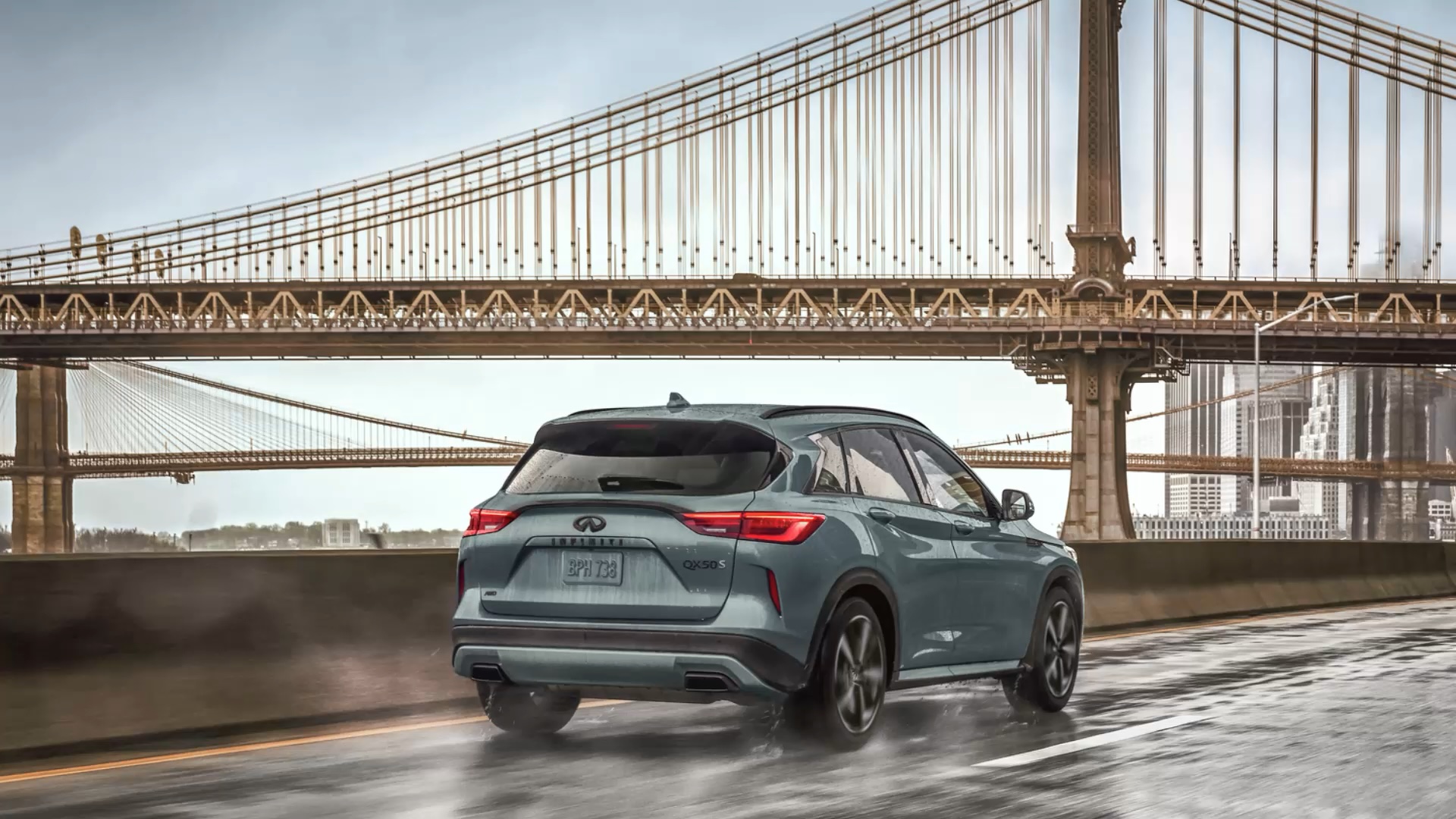 INFINITI QX50 driving towards bridge to demonstrate engine performance
