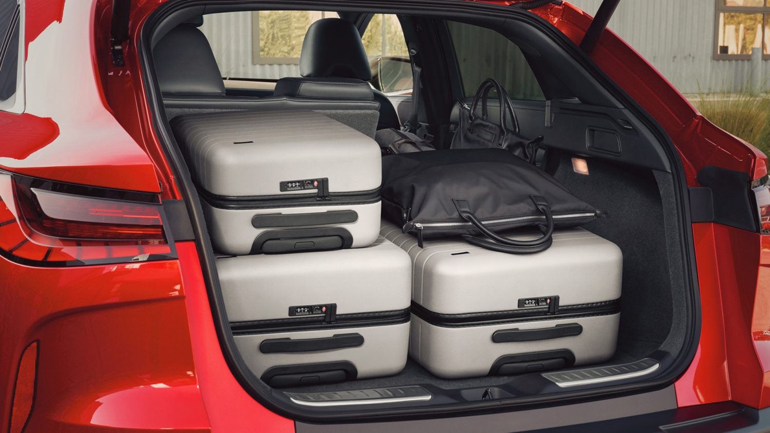 QX55 cargo area with seats up to show expandable luggage capacity