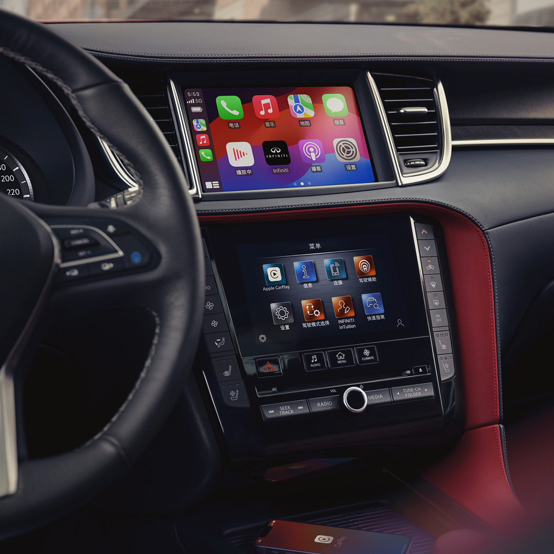 Dual touchscreen display in the QX55 showing Apple CarPlay and vehicle controls