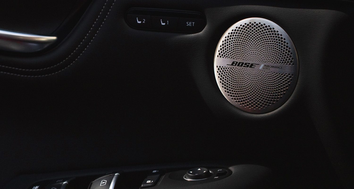 Close-up of Bose speaker grille in QX55 front door panel