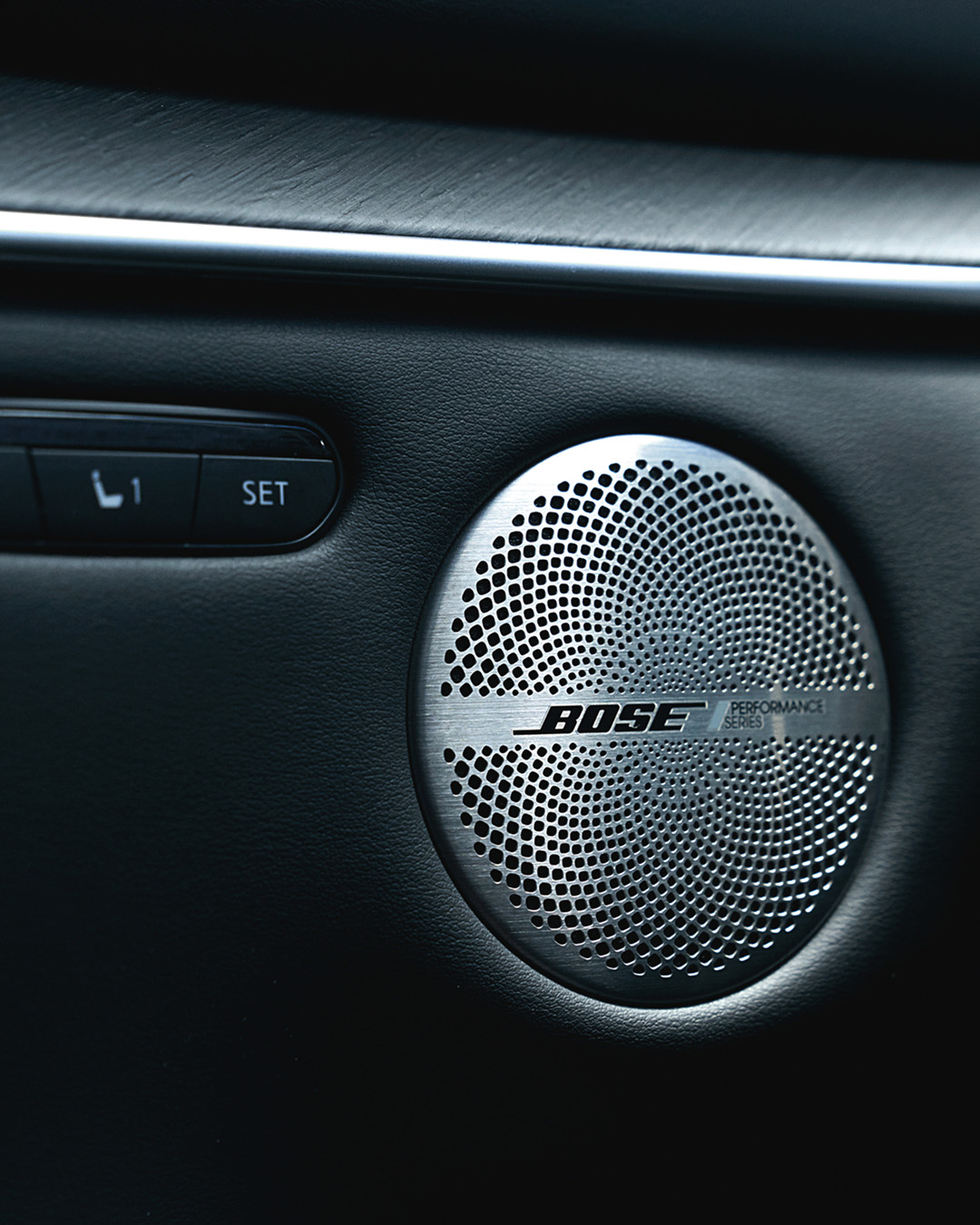 Close-up of Bose Performance Series speaker in the INFINITI QX55