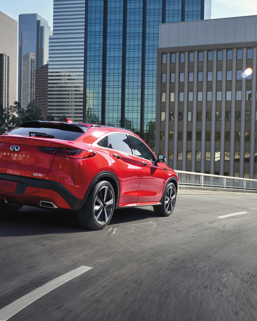 INFINITI QX55 driving in city with Lane Departure Warning