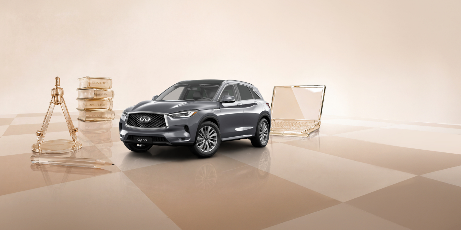 Owner walking towards 2025 INFINITI QX50 compact 5-seater SUV