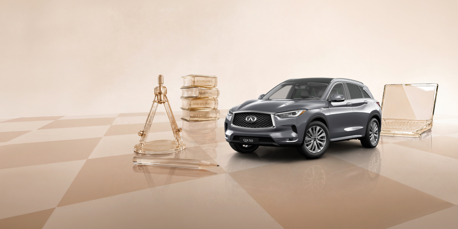 Owner walking towards 2025 INFINITI QX50 compact 5-seater SUV
