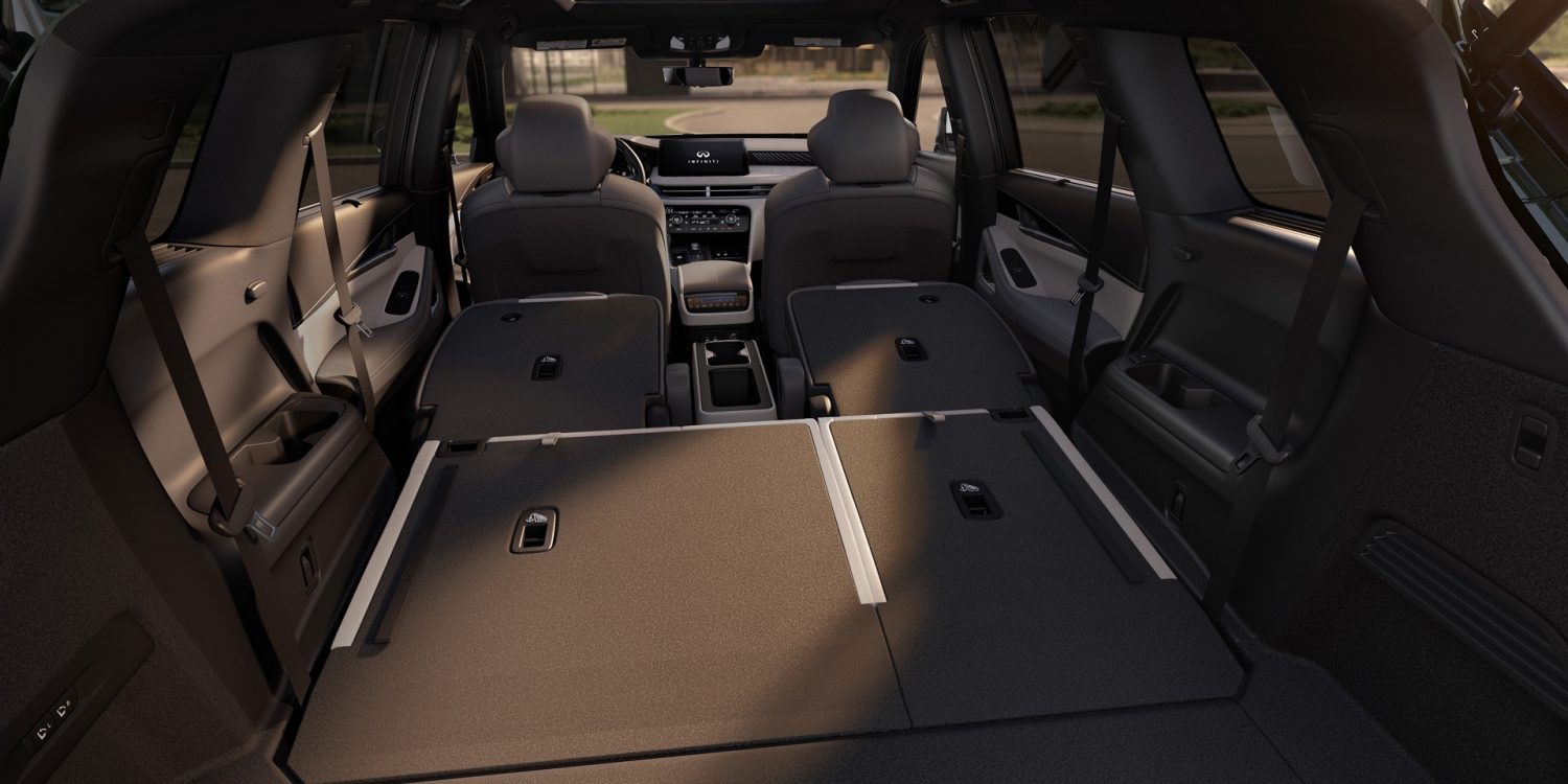 Split view of QX60 rear cargo area with one side of seats folded flat for max cargo