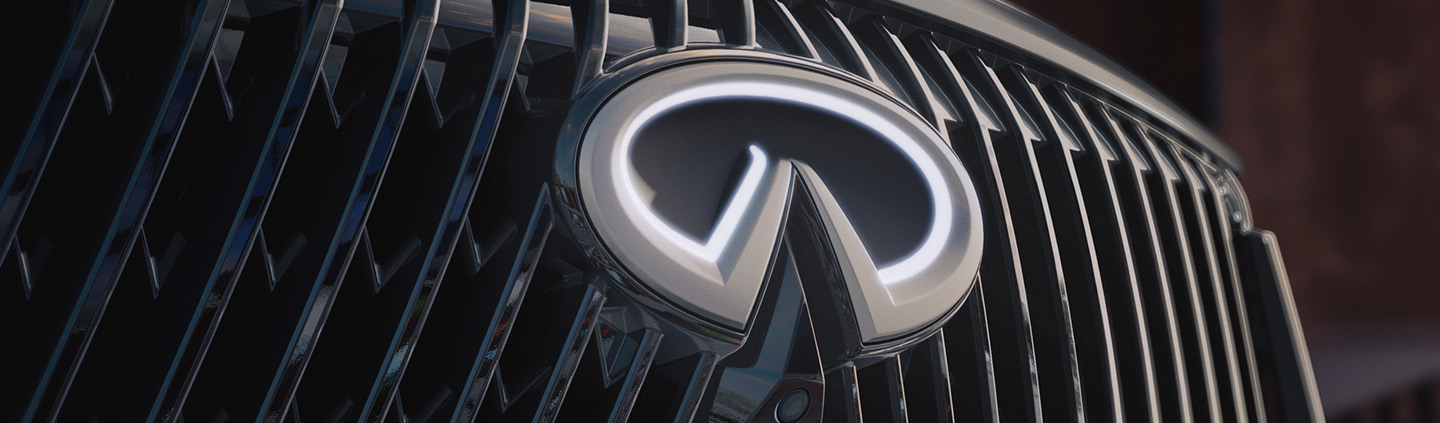 2026 INFINITI QX80 closeup of INFINITI emblem