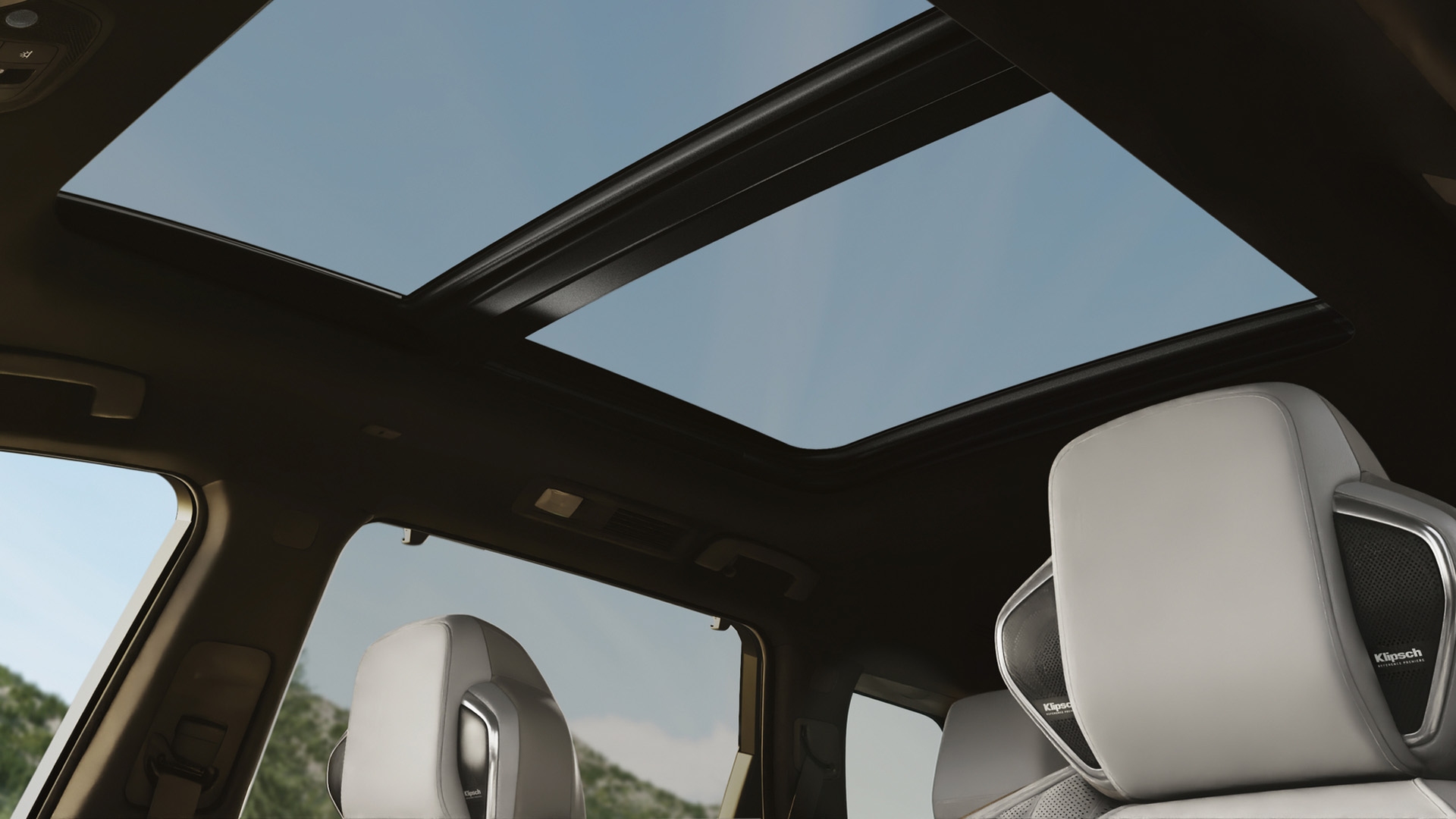 Open panoramic moonroof bringing natural light into INFINITI QX60 cabin