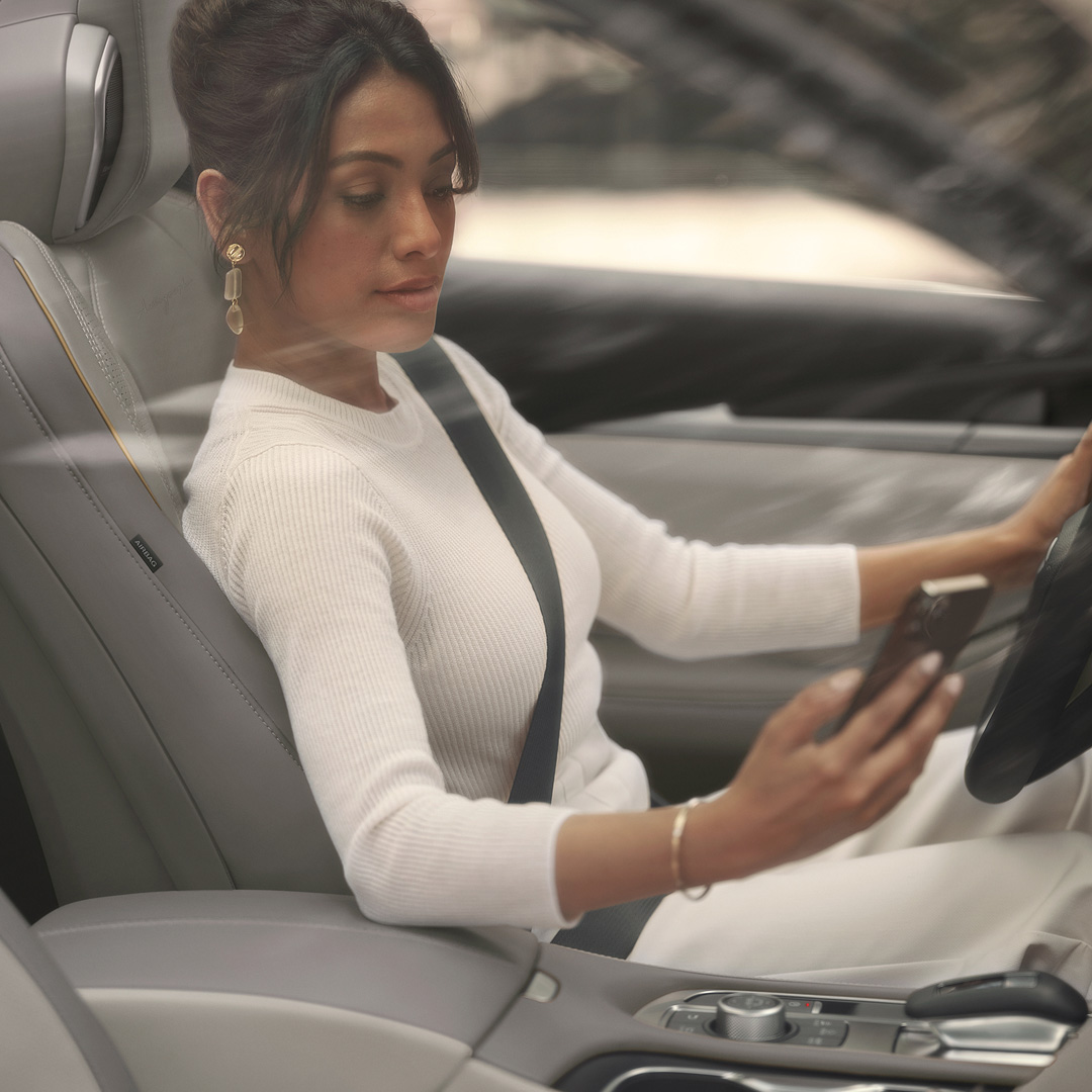 Woman enjoying quiet interior with laminated acoustic glass and sound insulation