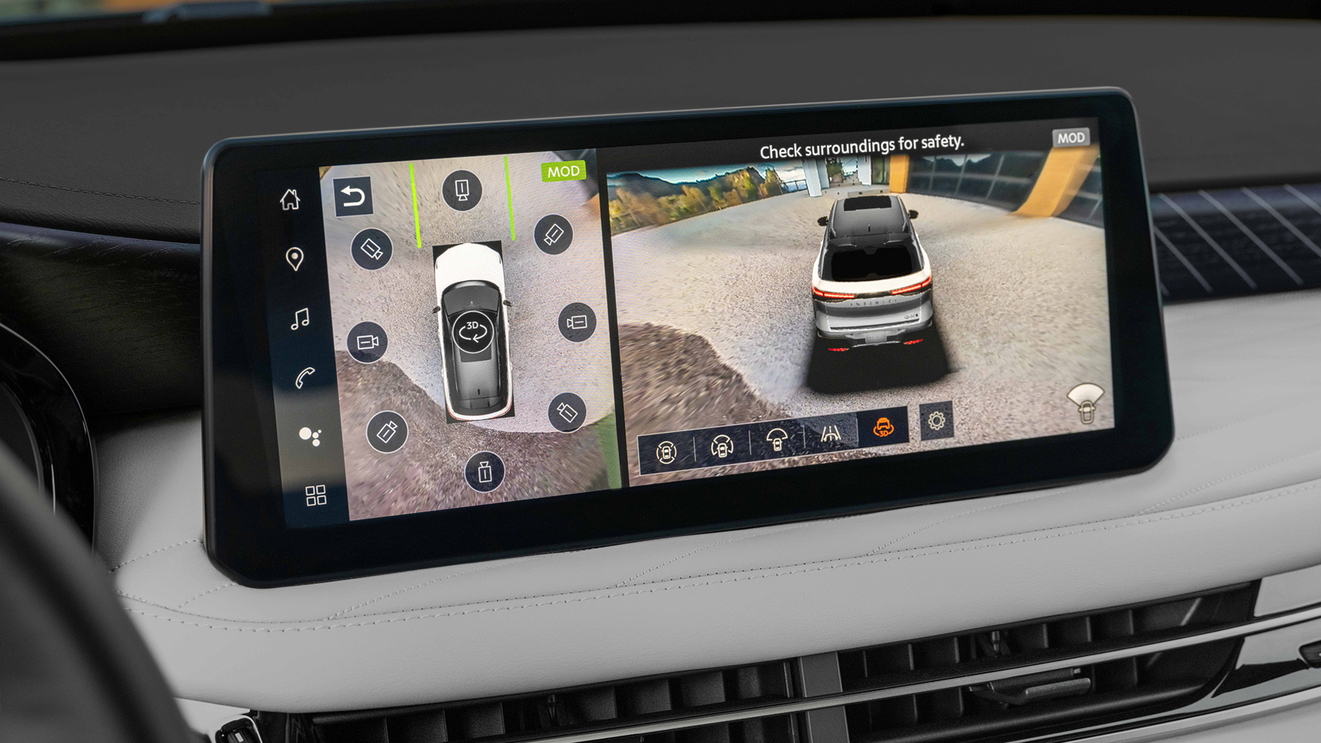 Close-up of QX60 center console with Android Auto puck and wireless charging pad