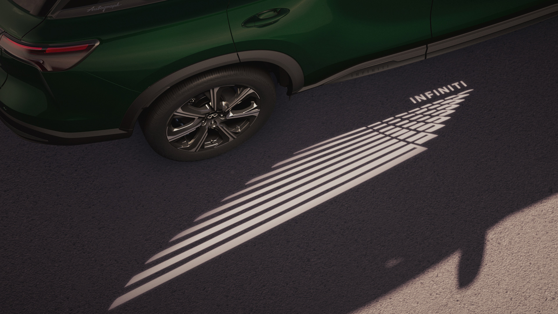 Welcome light projection graphic displayed from the side of the QX60 onto the ground