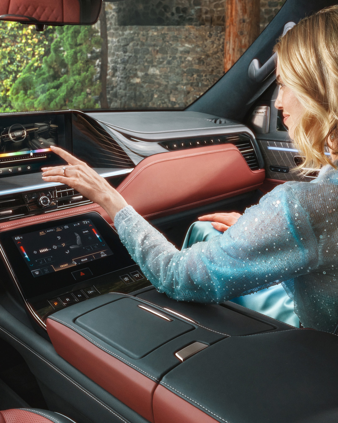 INFINITI owner walking toward QX60 in driveway