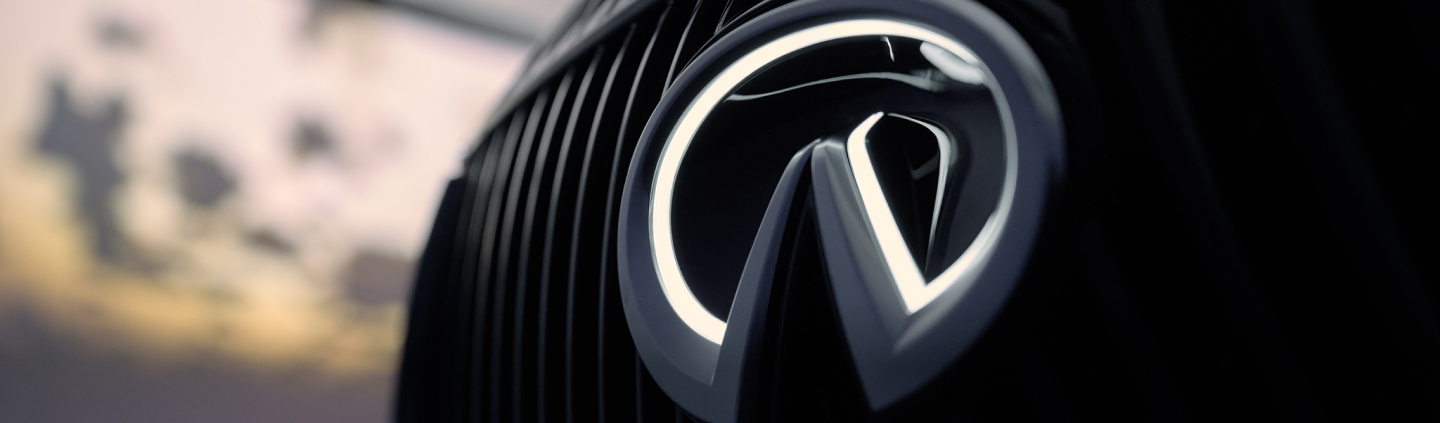 2026 INFINITI QX80 closeup of INFINITI emblem