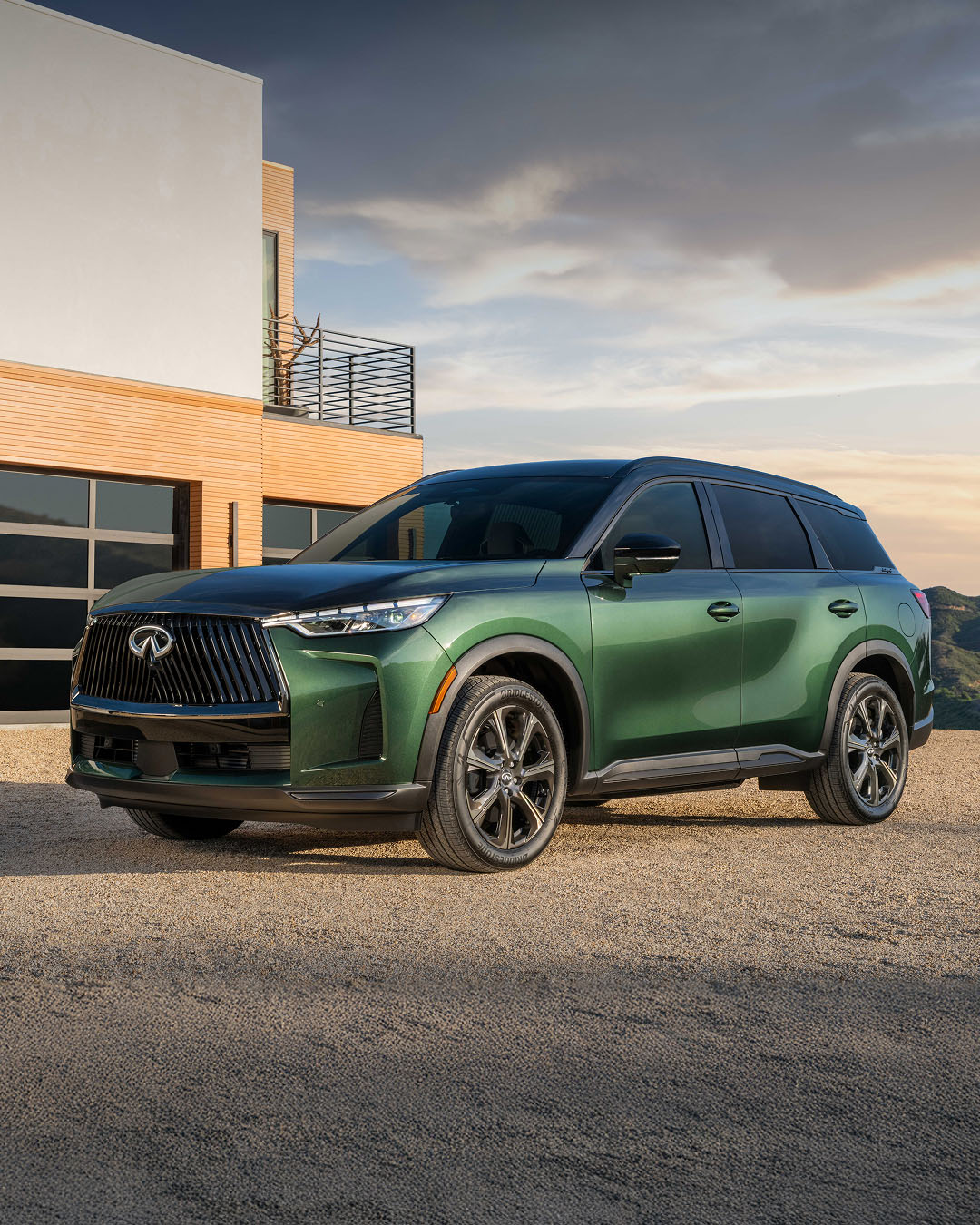 2025 INFINITI QX60 luxury 7-seater SUV parked outside a flower shop
