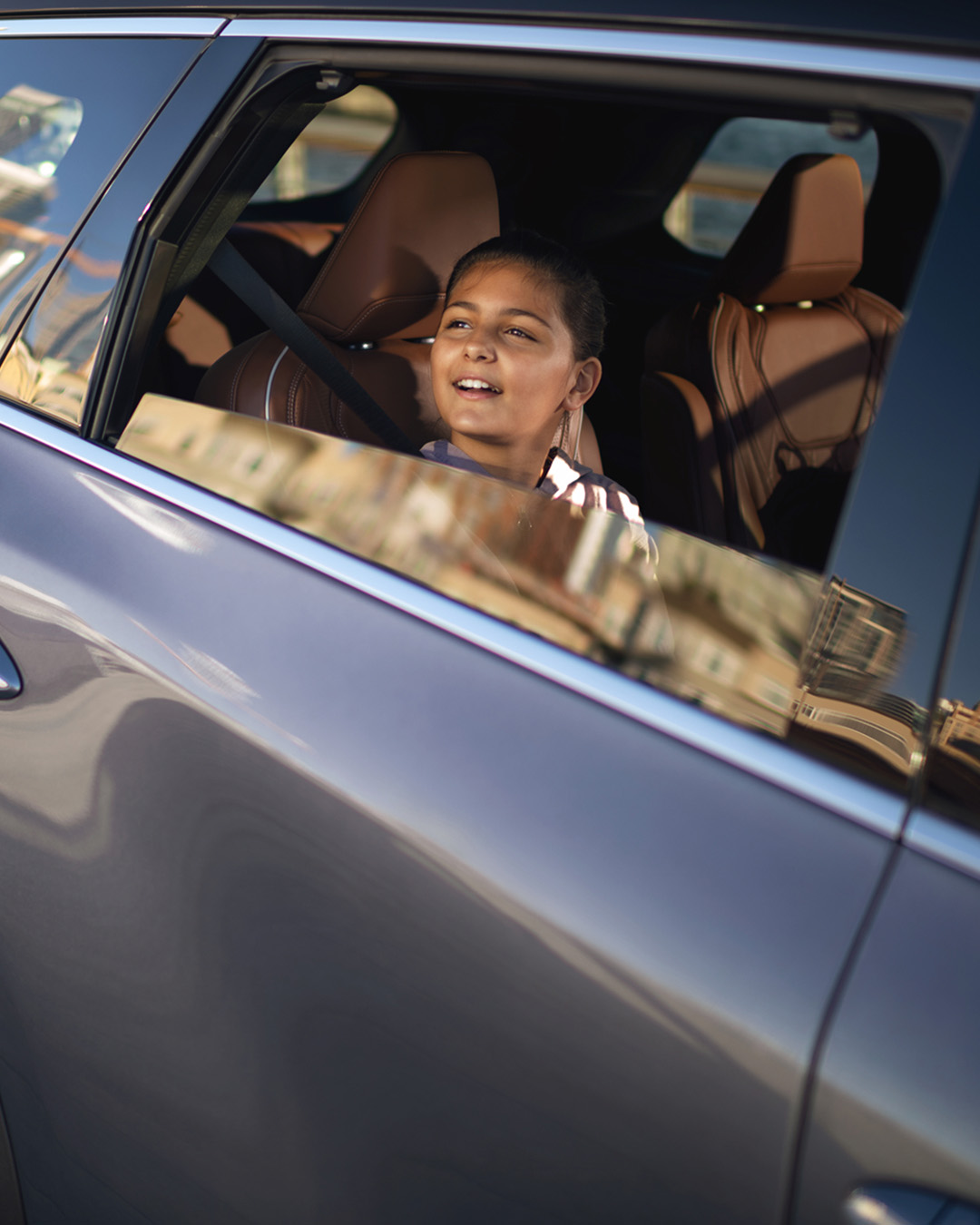 Owner leaning on INFINITI QX80