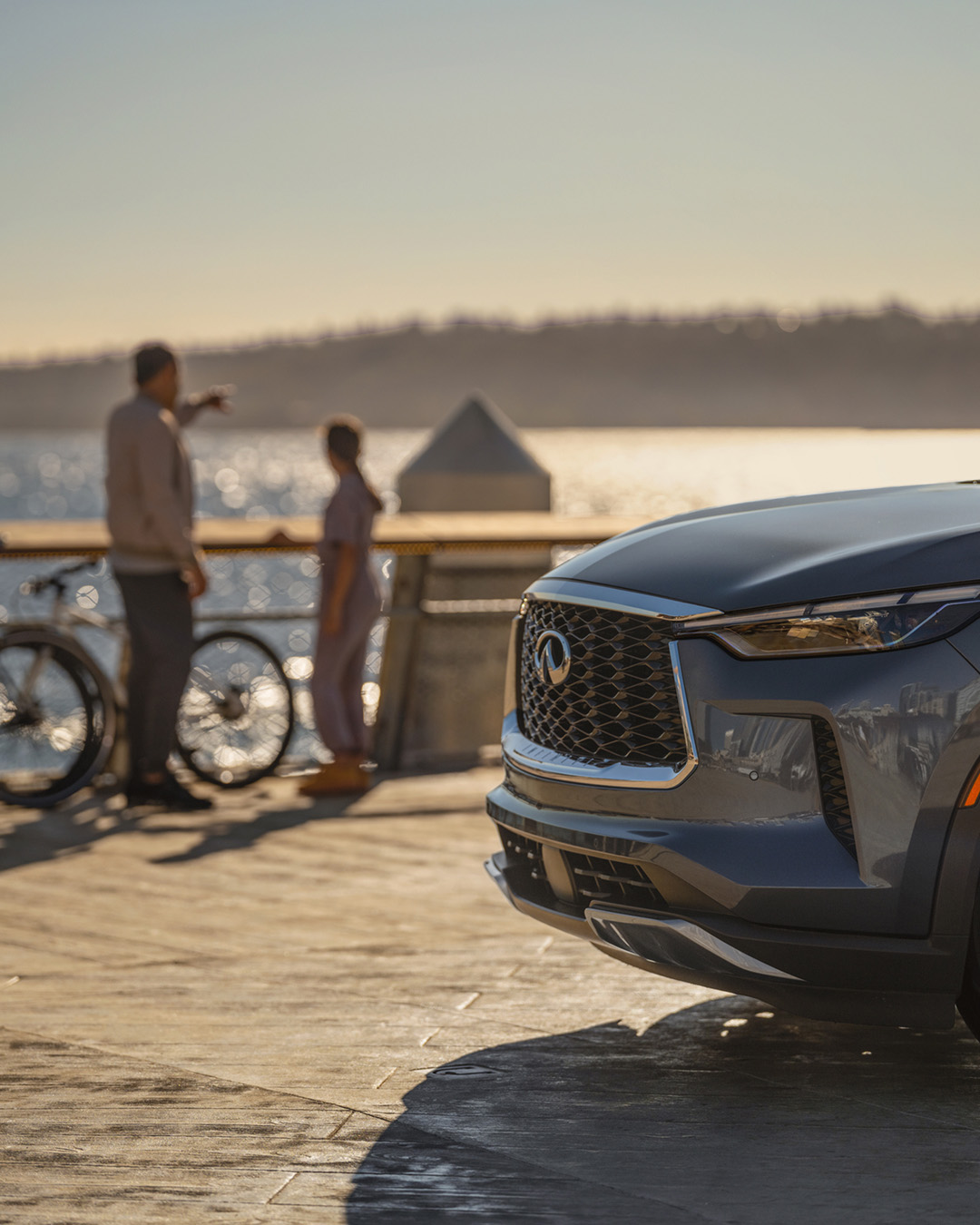 Front end of INFINITI car parked at lake 