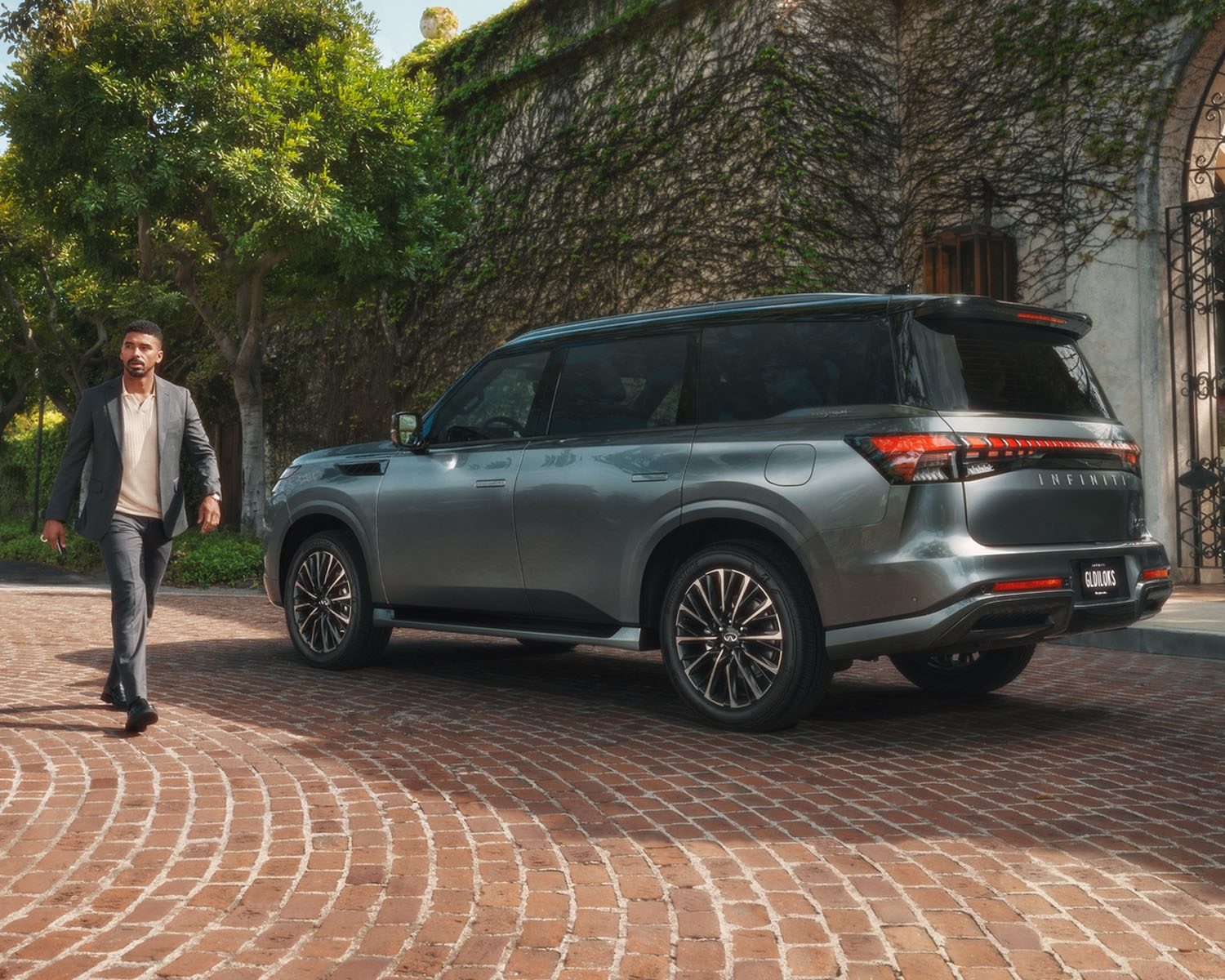 Owner walking past INFINITI QX80