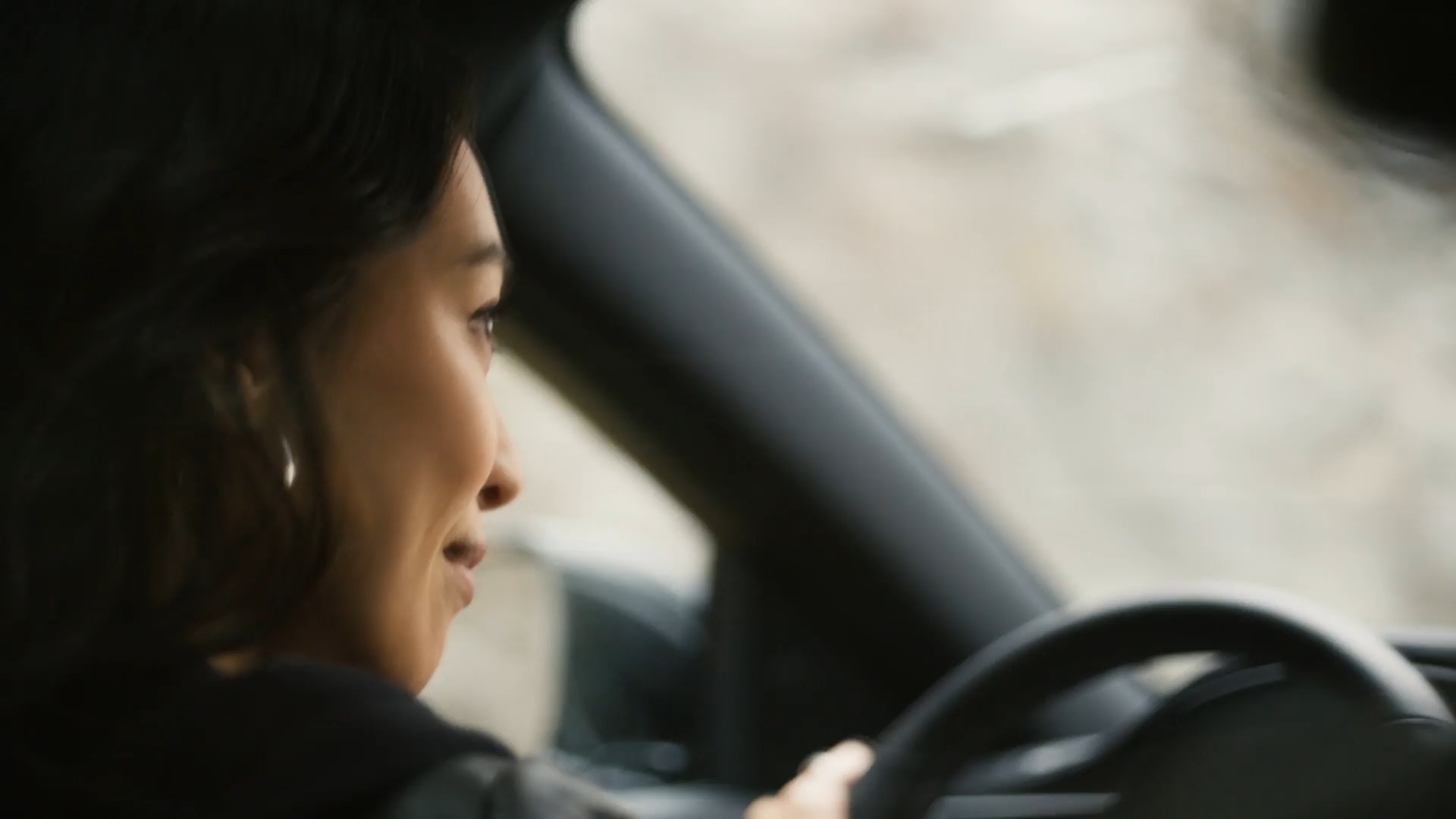 Closeup of INFINITI driver looking out the windshield