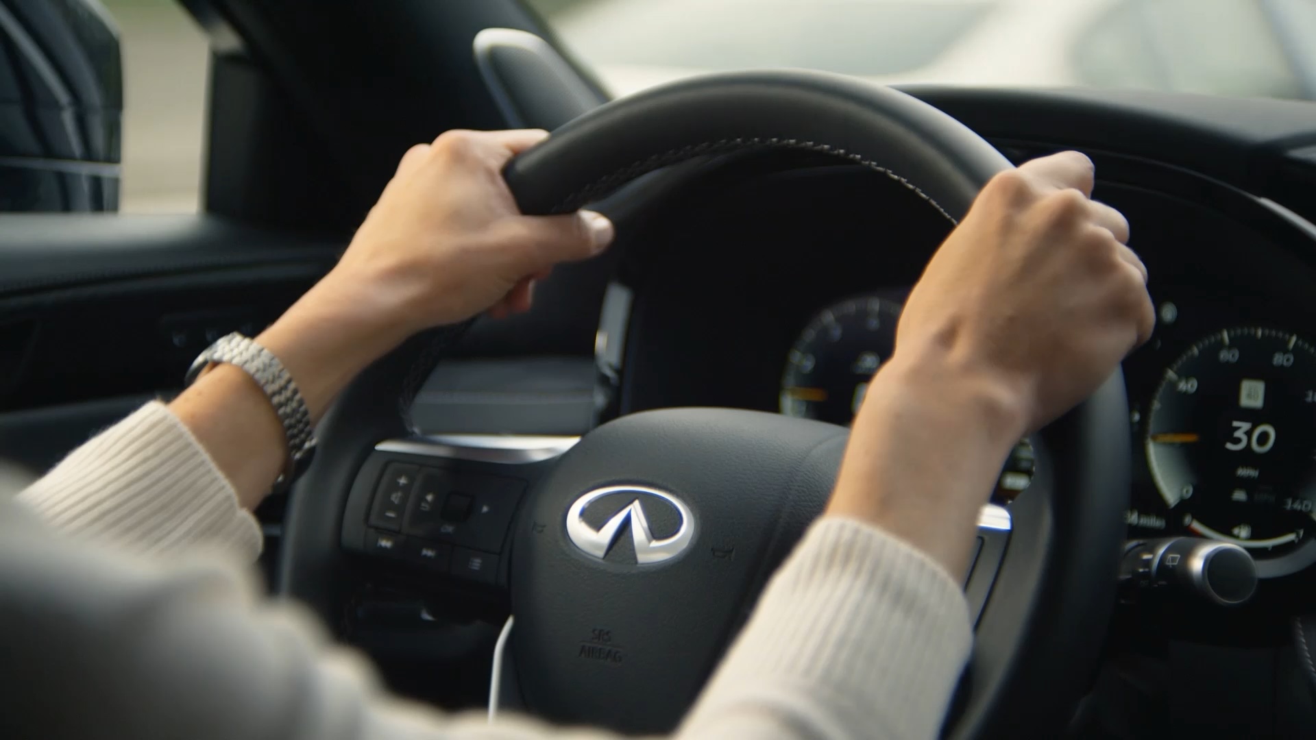 Driver utilizing ProPILOT Assist in an INFINITI car for enhanced confidence on the road