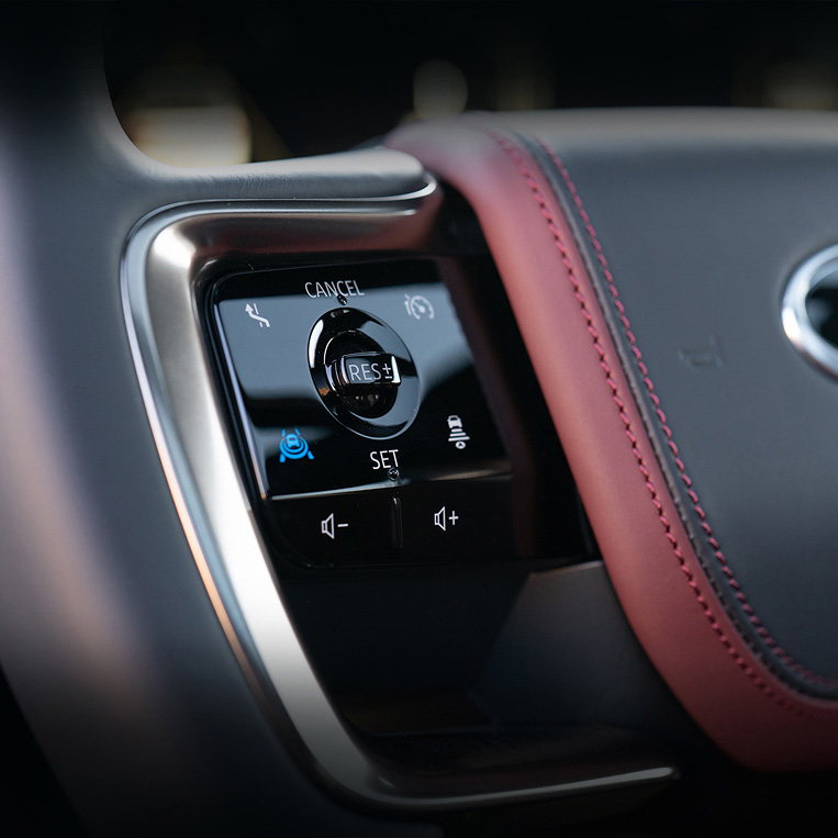 Close-up of INFINITI steering wheel with ProPILOT Assist controls for seamless driver assistance