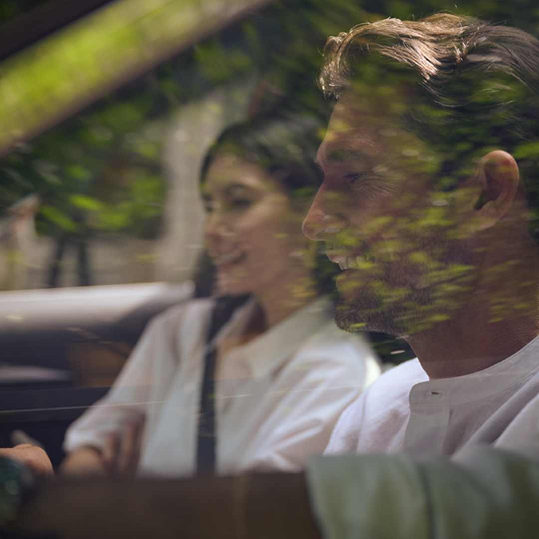 Window view of INFINITI car driver and passenger 
