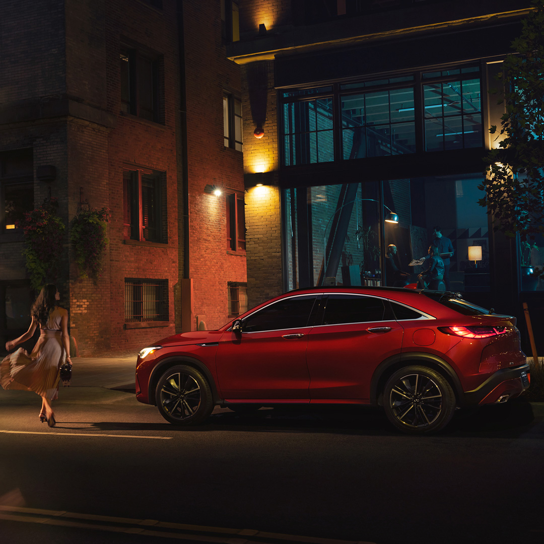 Side view of red INFINITI QX55