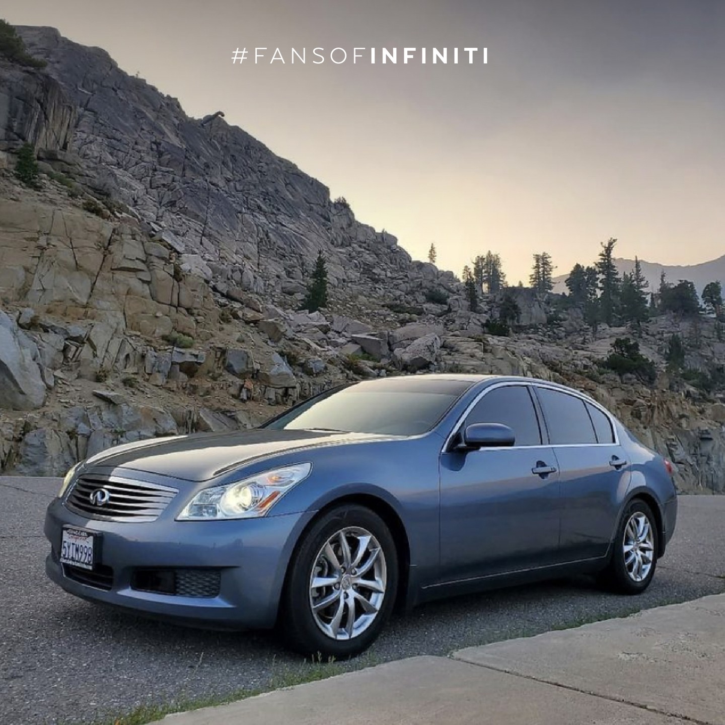 INFINITI G35 luxury sport coupe parked in front of rocky mountains