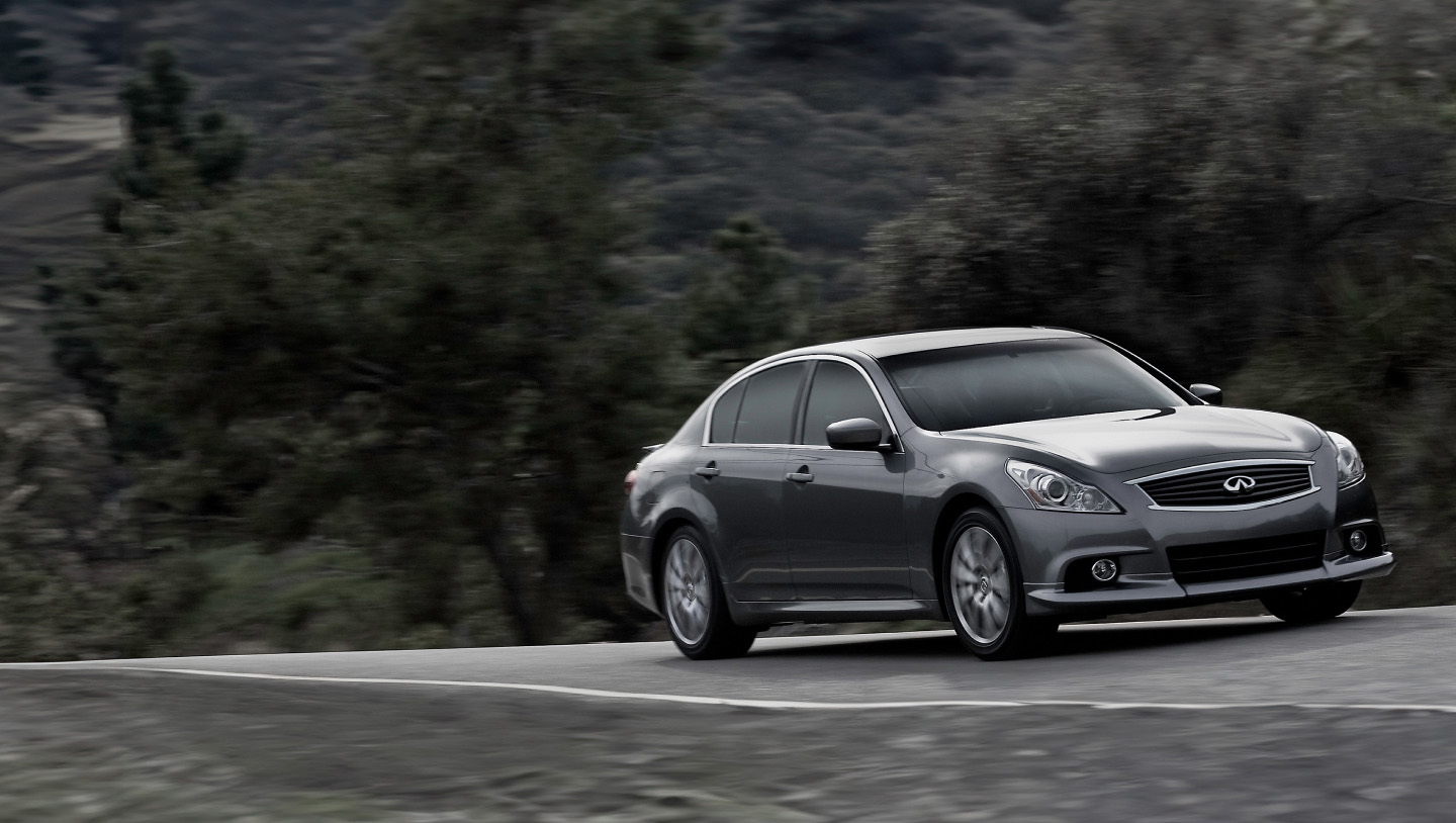 Angled view of a INFINITI G37 luxury coupe driving
