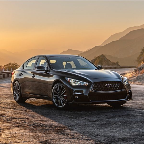 INFINITI Q50 on mountain road during sunset