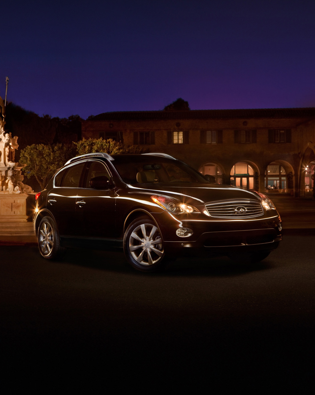 INFINITI EX35 parked in front of house at night