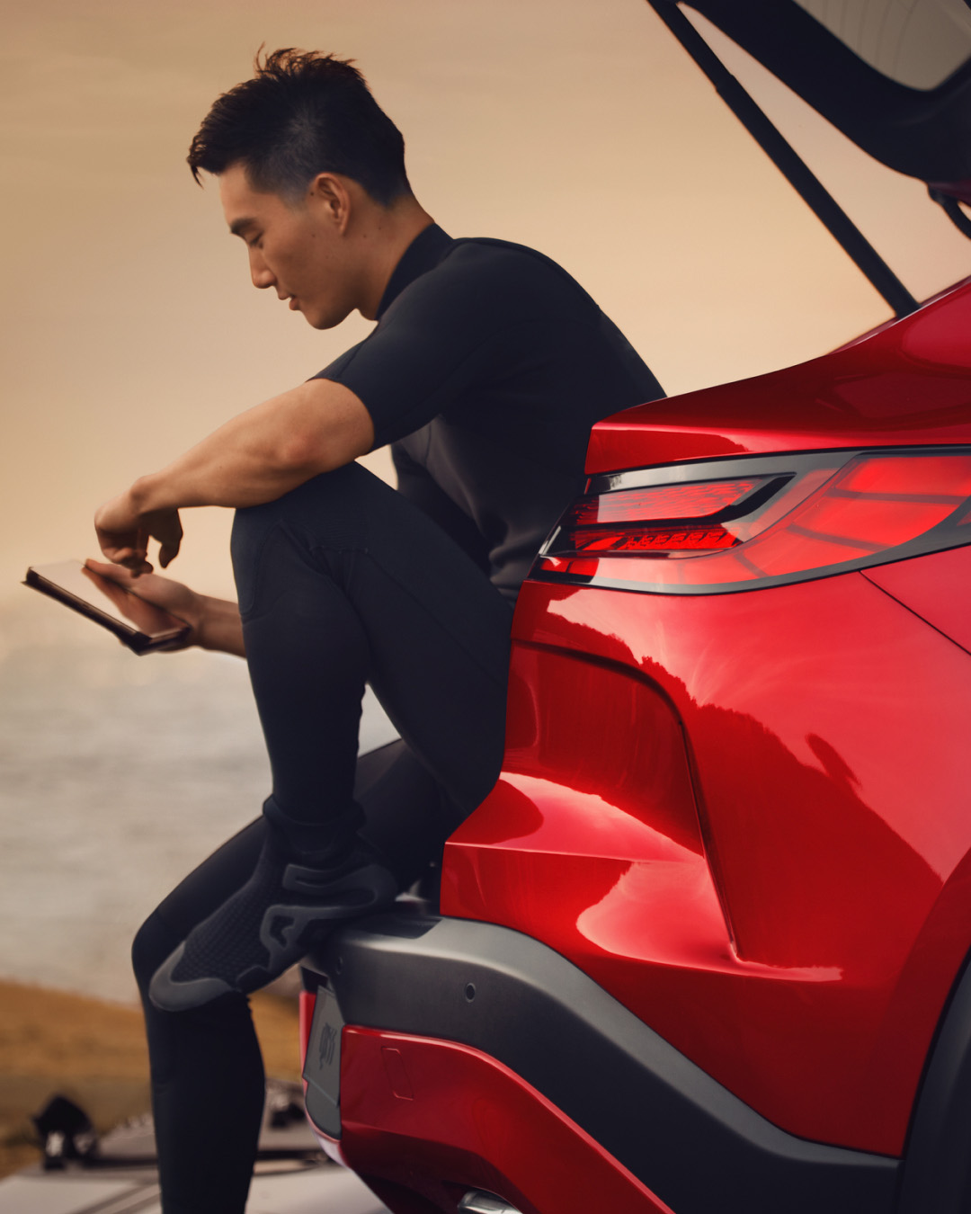 INFINITI owner sitting on cargo space