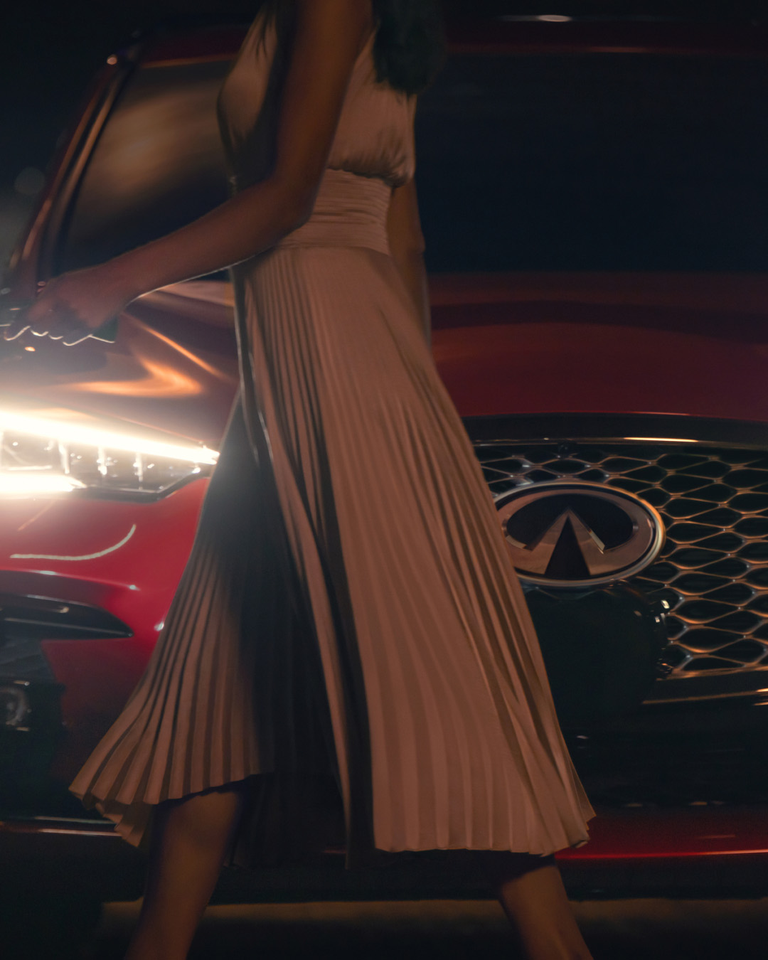 Owner walking past front of INFINITI Vehicle