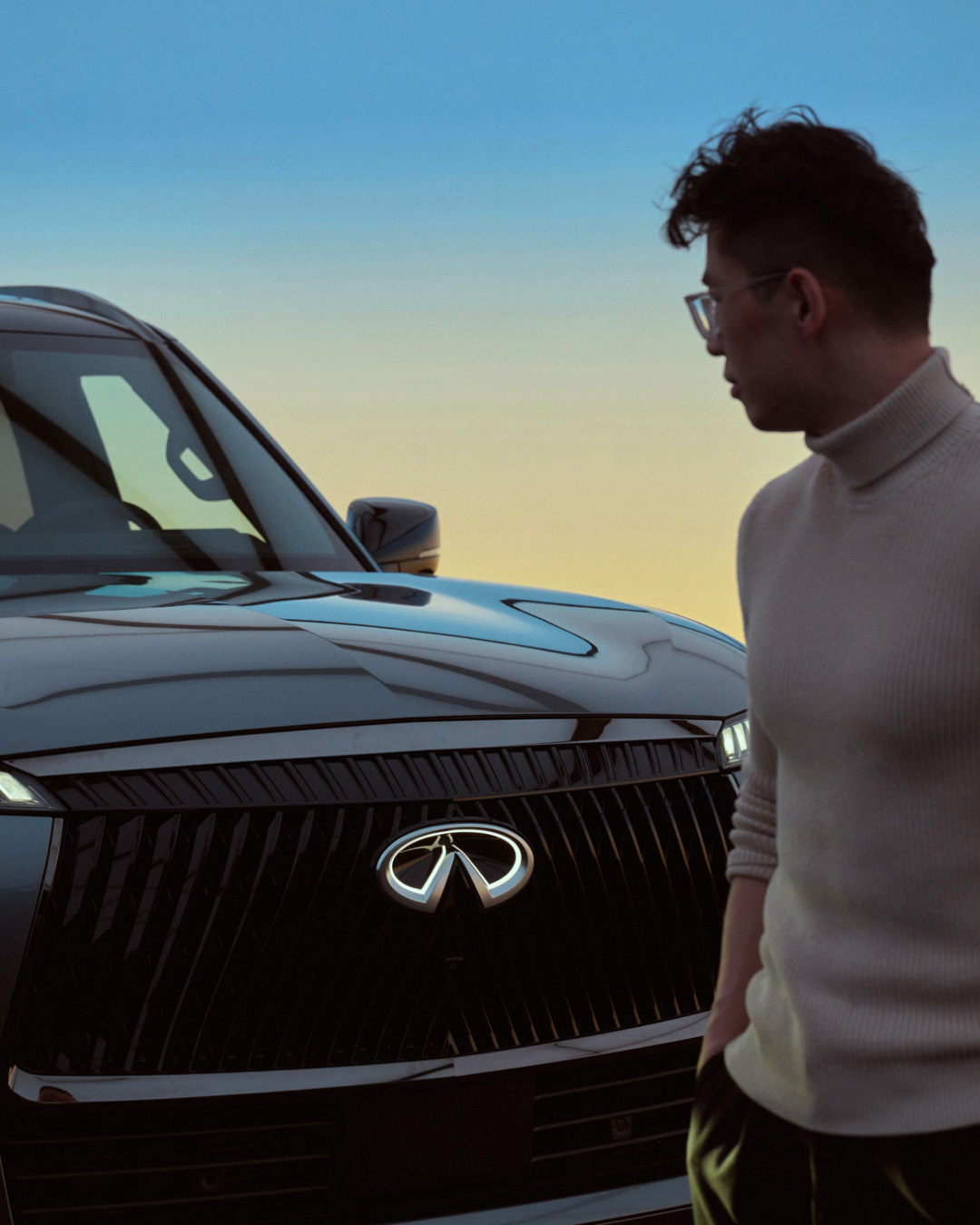 Owner walking past front of INFINITI QX80