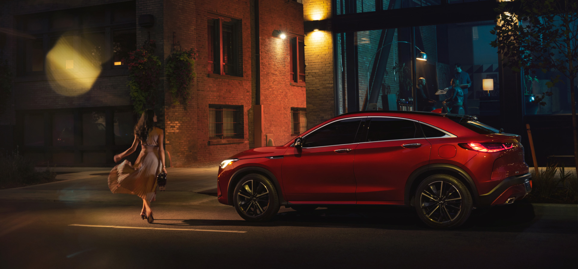 Side view of INFINITI QX55 in red