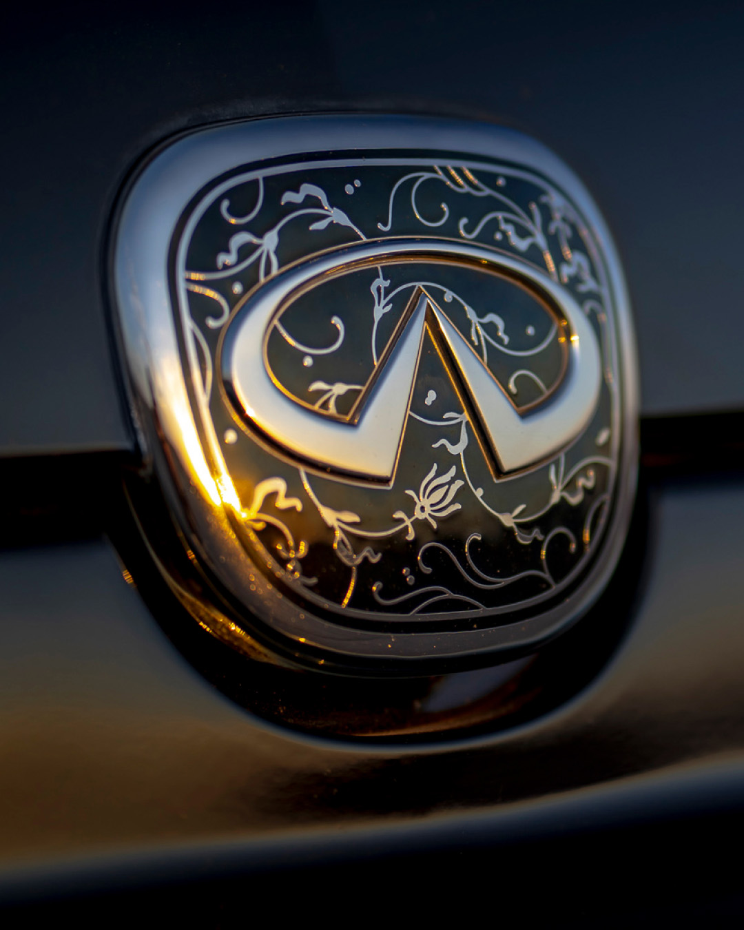 INFINITI Q45 Luxury Sedan floral detailing badge