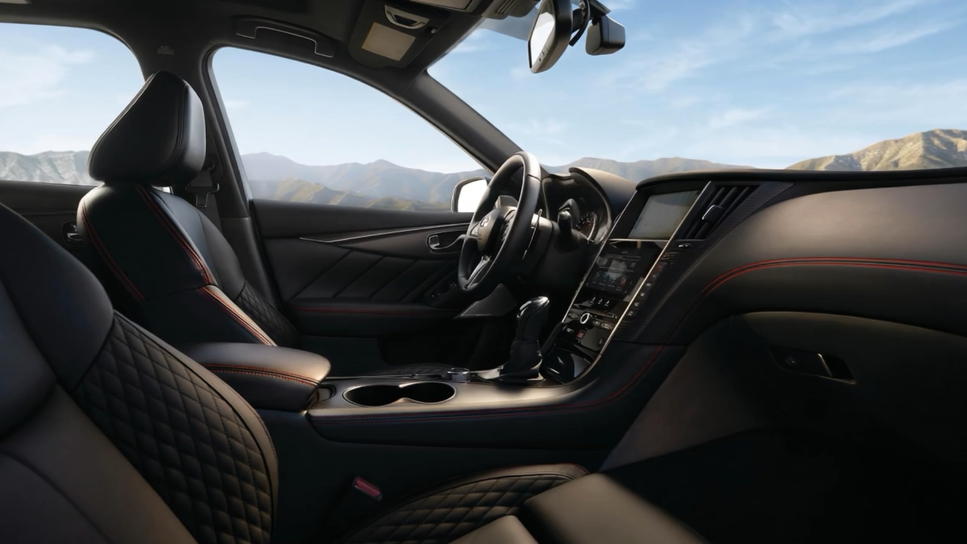 Interior of Q50 with mountain backdrop