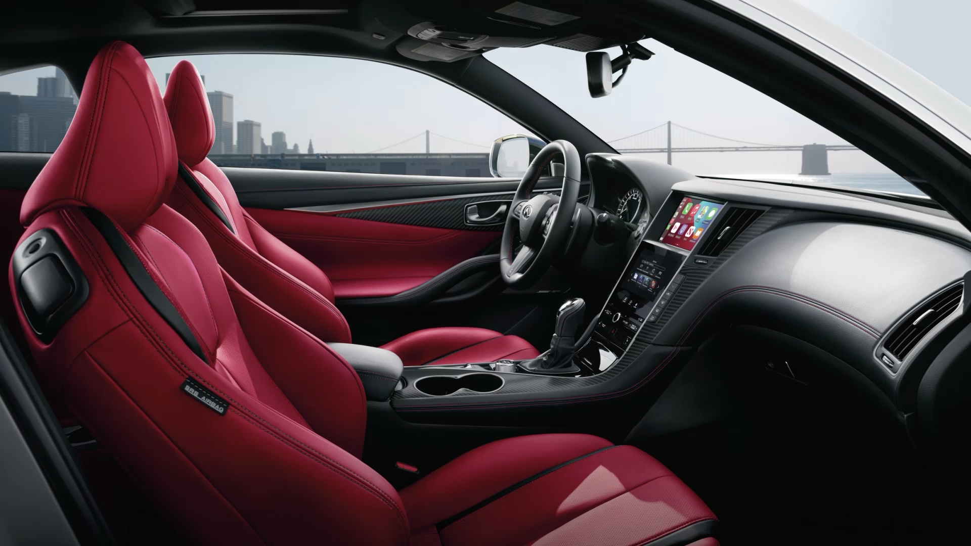 Interior view of INFINITI Q60 with red seats