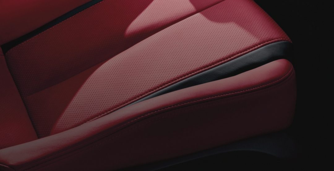 Closeup of INFINITI Q60 Monaco Red leather interior