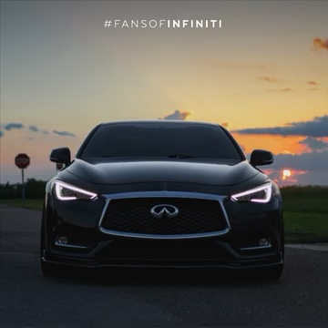 Front view of INFINITI Q60 parked in front of sunset