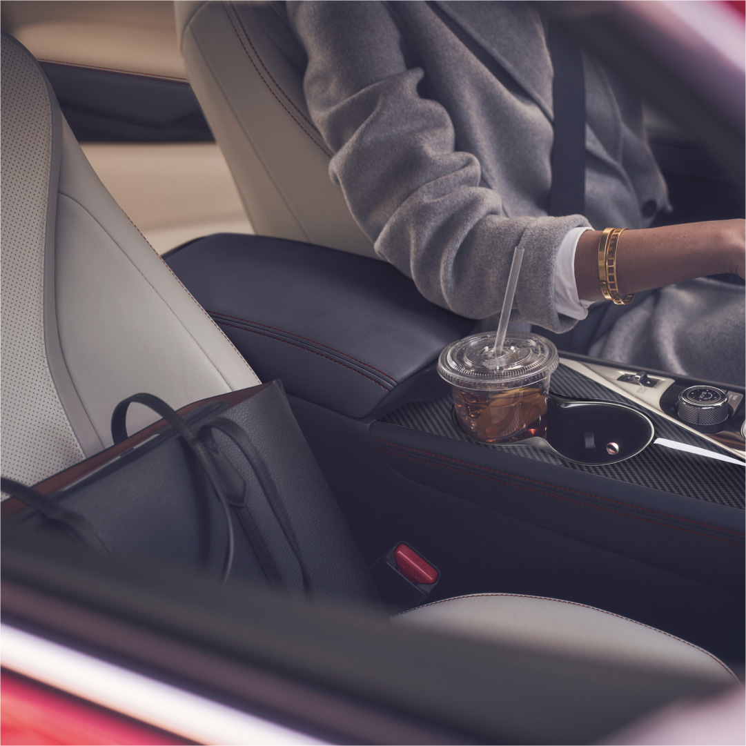 INFINITI Q60 owner sitting in race-style seats