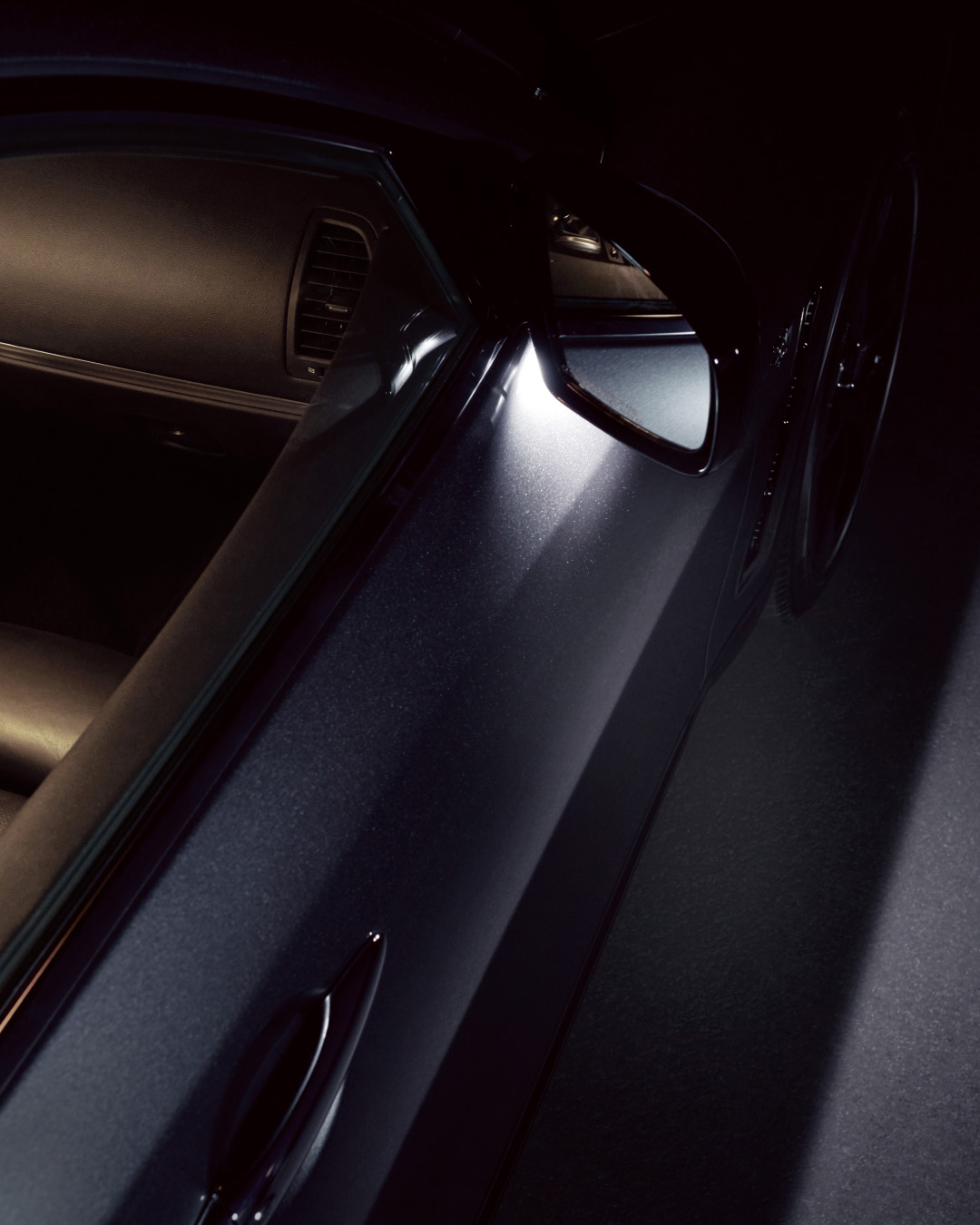 Closeup of INFINITI QX70 Luxury Crossover SUV illuminated entry system